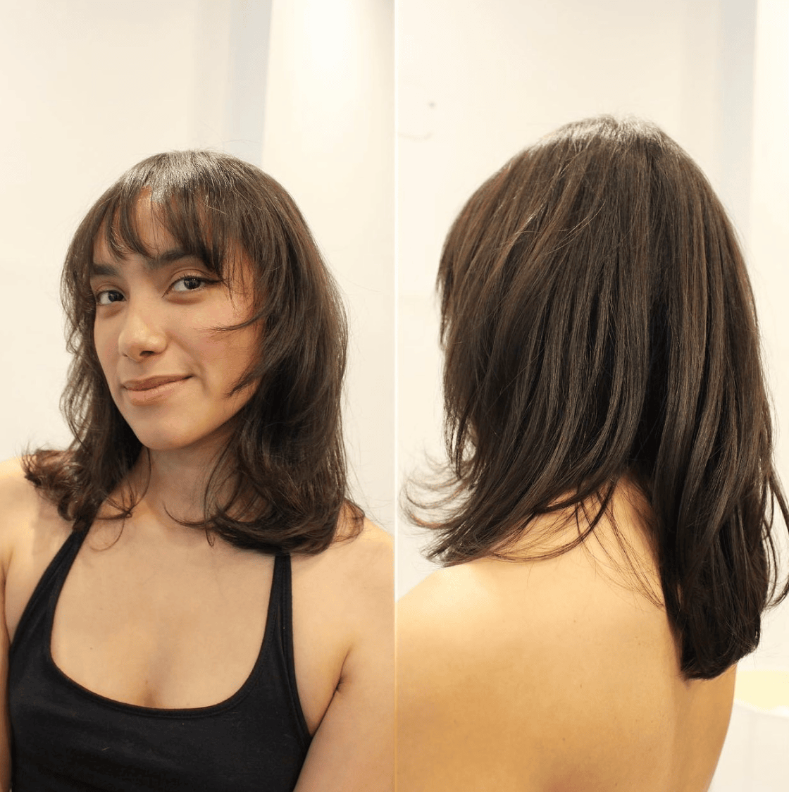 a woman with black hair had a layered haircut