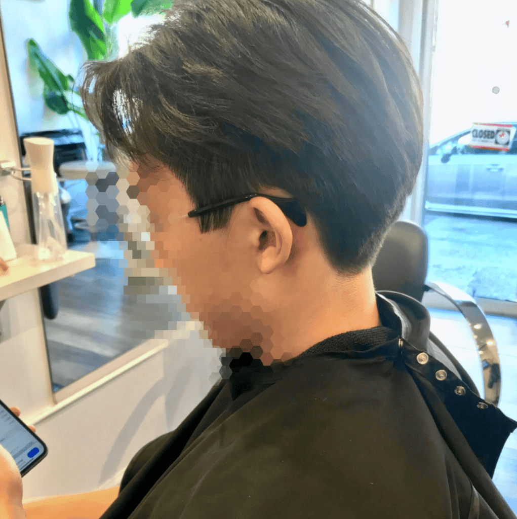 a man with a layered haircut and blowout